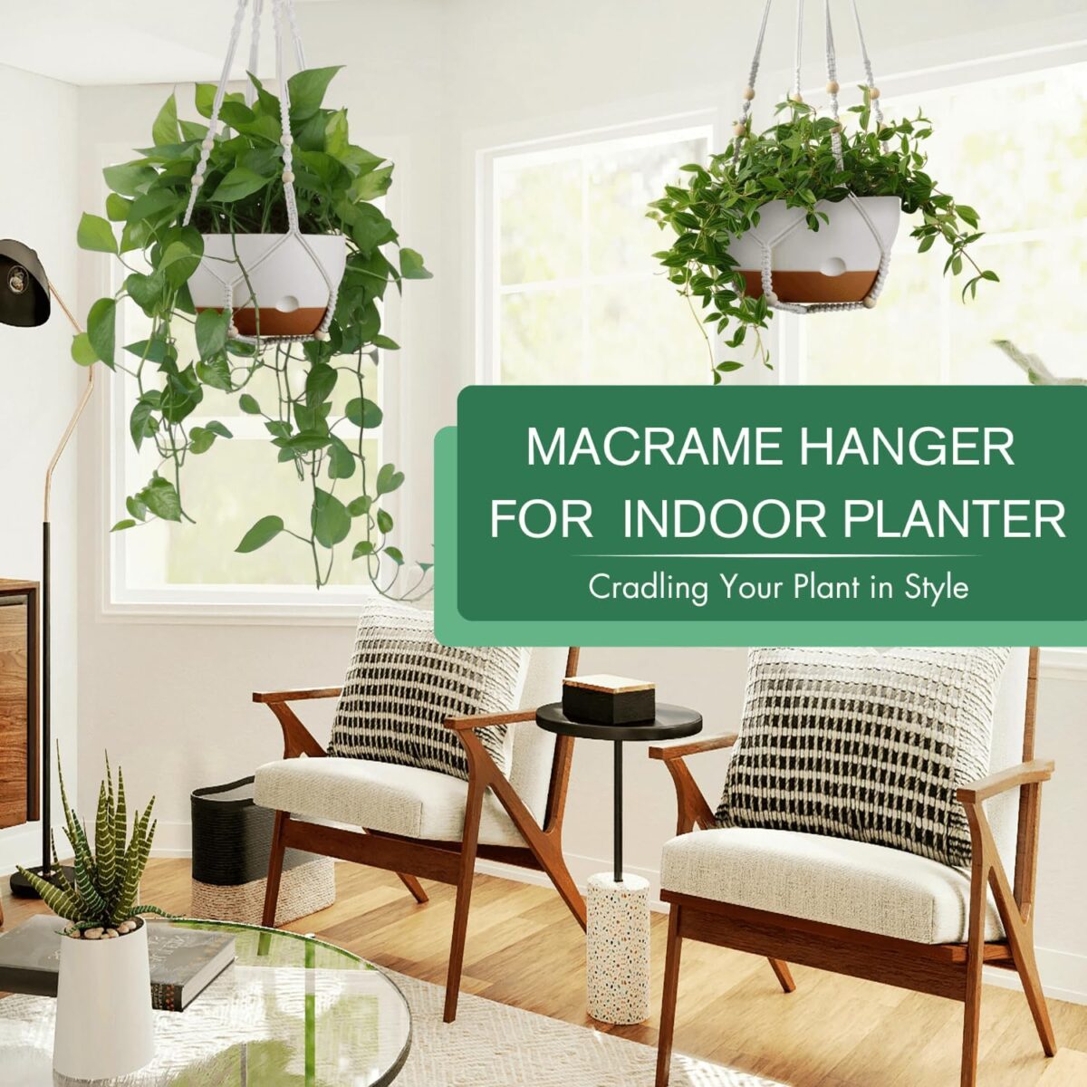 Two white hanging planters with green plants suspended from the ceiling in a bright indoor space.